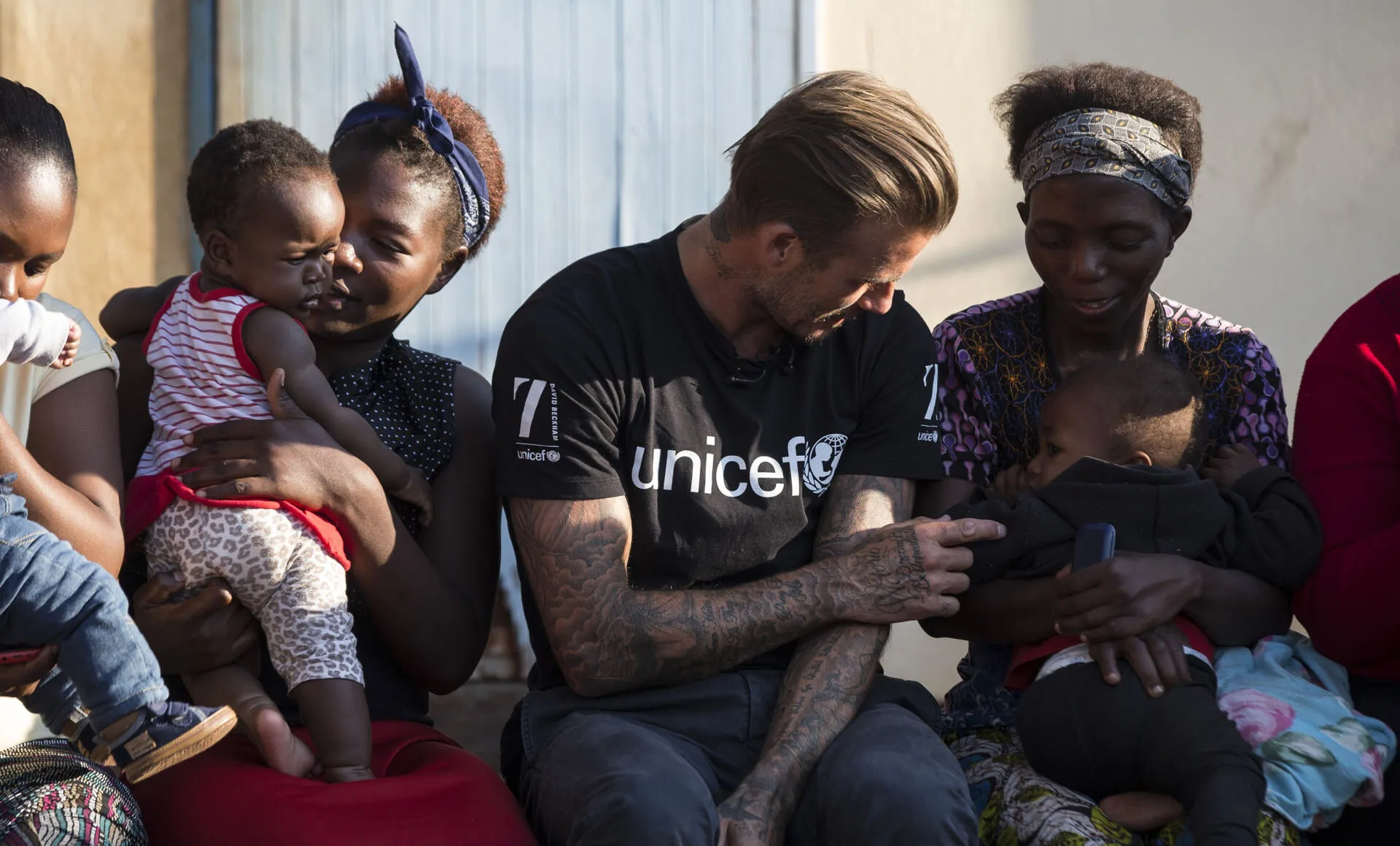 a man talking with mothers