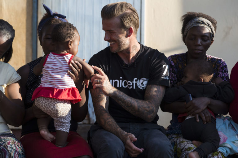 UNICEF Goodwill Ambassador David Beckham meets a a support group of mums and babies living with HIV at the Siphofaneni Health Clinic in Siteki, Swaziland on June 7, 2016.