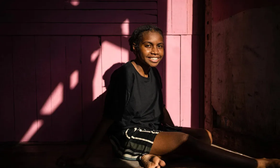 a girl smiling at camera