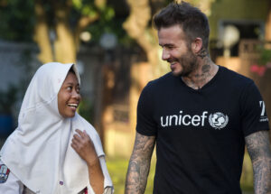 a man and girl smiling and talking